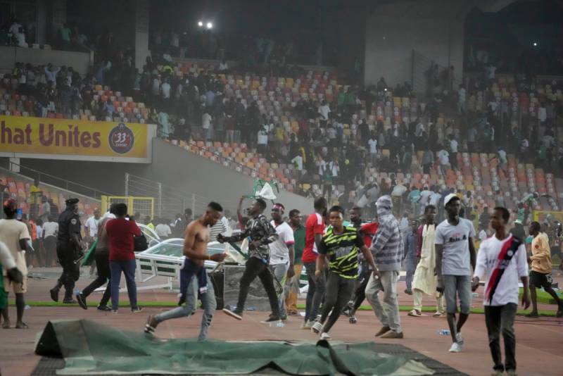 DOCTOR DEAD Fifa doctor dies after furious Nigeria fans storm pitch in sickening scenes
