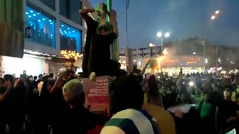 Iranian women burn their hijabs as hundreds protest death of Mahsa Amini