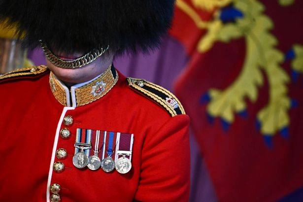 Brutal reason why Queen's guards wear helmet straps under lips not chin
