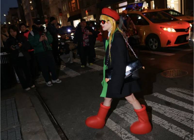 Why Is Everyone Wearing These Cartoonish Red Boots?