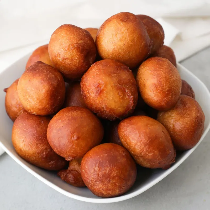 Nigerians Try Each Other's Puff Puff